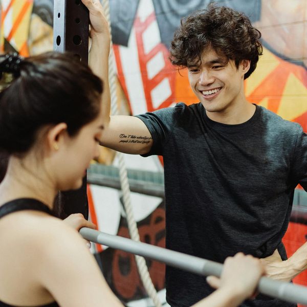 Person smiling and looking relaxed after a workout session.
